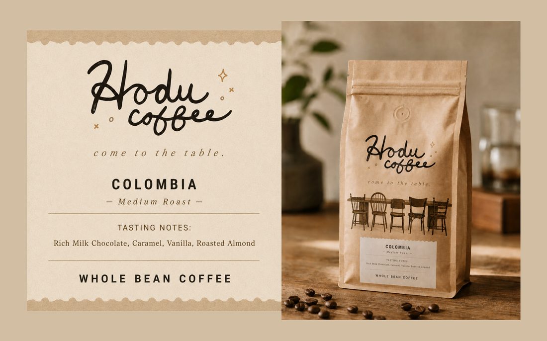 Hodu Coffee — Colombia, whole bean. Label with tasting notes: rich milk chocolate, caramel, vanilla, roasted almond — beside the kraft coffee bag